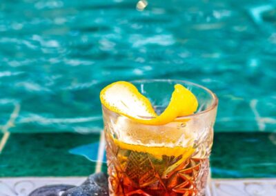 Old Fashioned cocktail poolside at Coco Casa Hoi An, Vietnam
