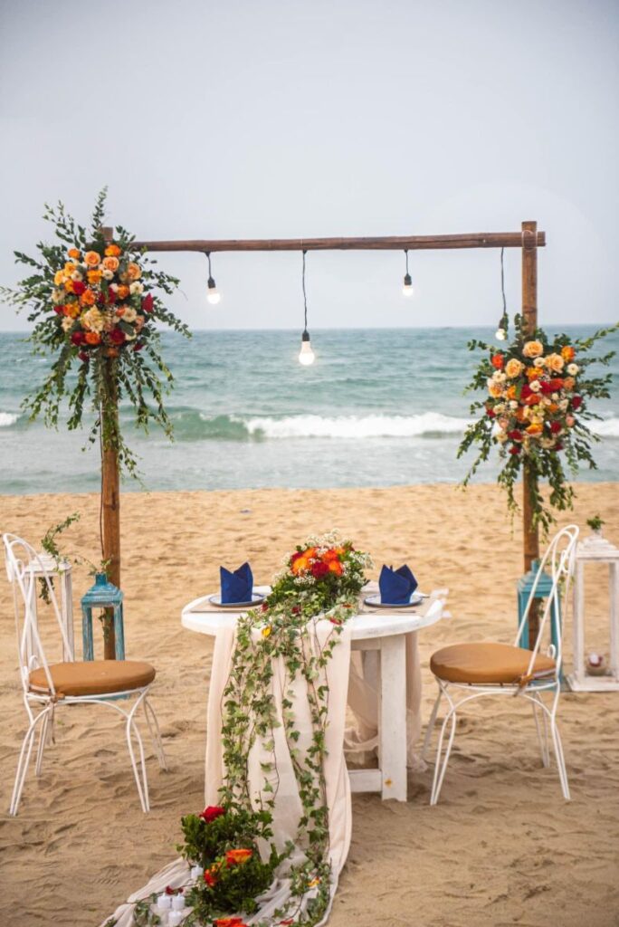 romantic dinner table setup on An Bang Beach at Shore Club in Hoi An, Vietnam